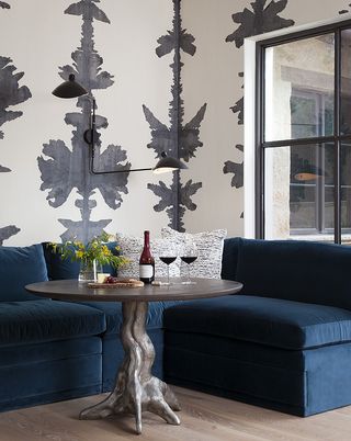 A banquette with an eye-catching wallpaper
