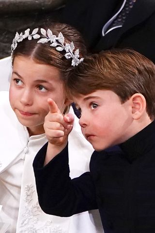 Britain's Prince Louis and Princess Charlotte attend the Coronation of King Charles III and Queen Camilla at Westminster Abbey