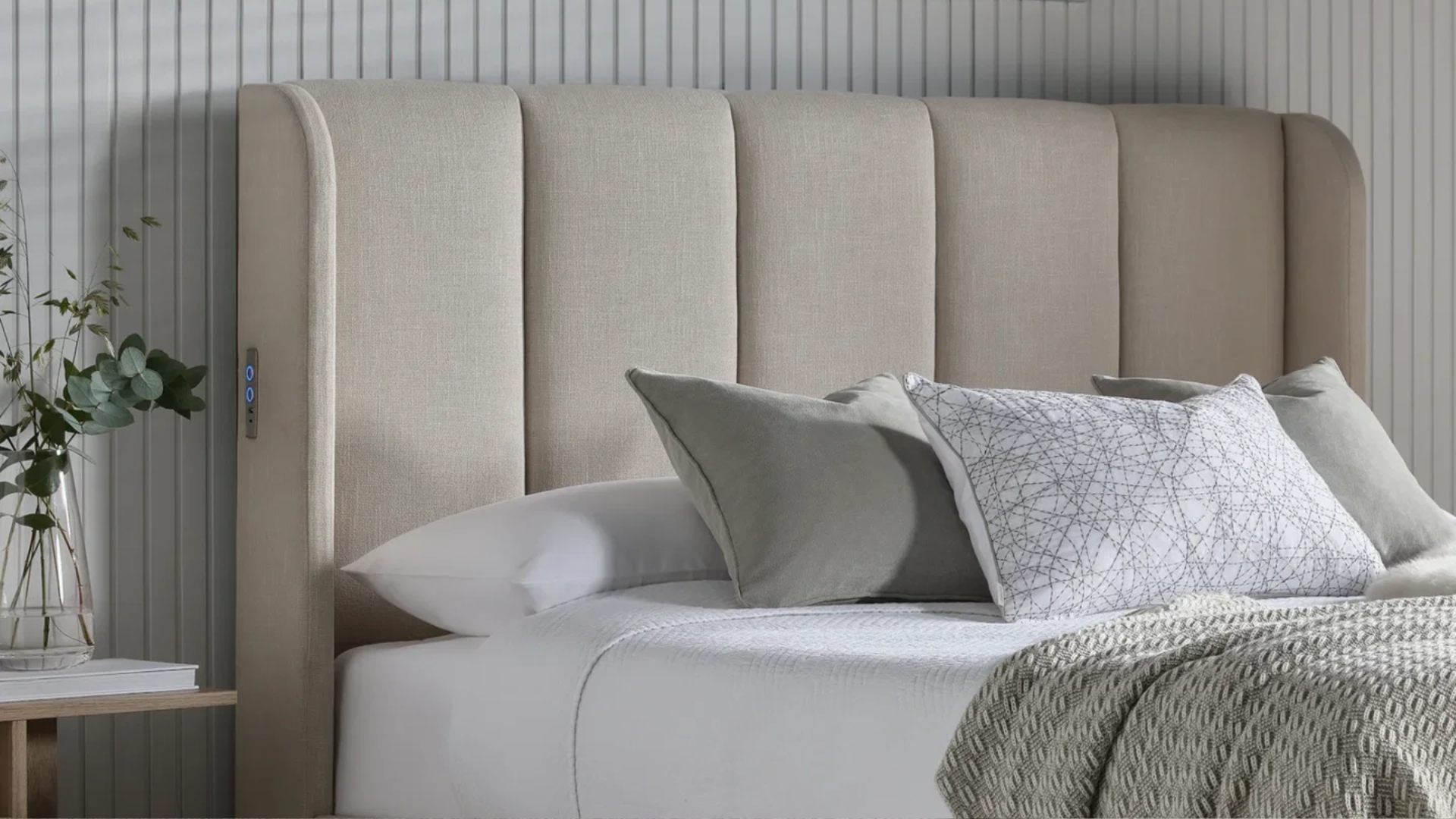 Time4Beds plush Bed Frame with a made-up sheet and blanket