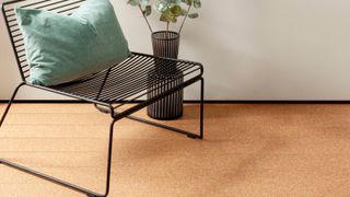 cork flooring in room with modern chair