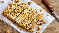Granola bar recipe on white paper and wooden table
