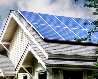 A roof of a home with solar panels