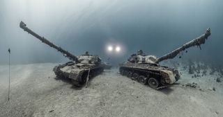two tanks sitting at the bottom of the ocean