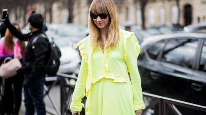 Street fashion, Clothing, Fashion, Yellow, Trench coat, Outerwear, Coat, Snapshot, Eyewear, Sunglasses, 