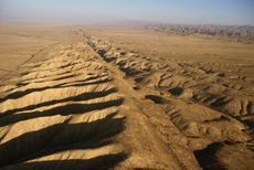 The San Andreas fault system is more than 800 miles (1,300 kilometers) long, and as deep as 10 miles (16 km) in some spots.