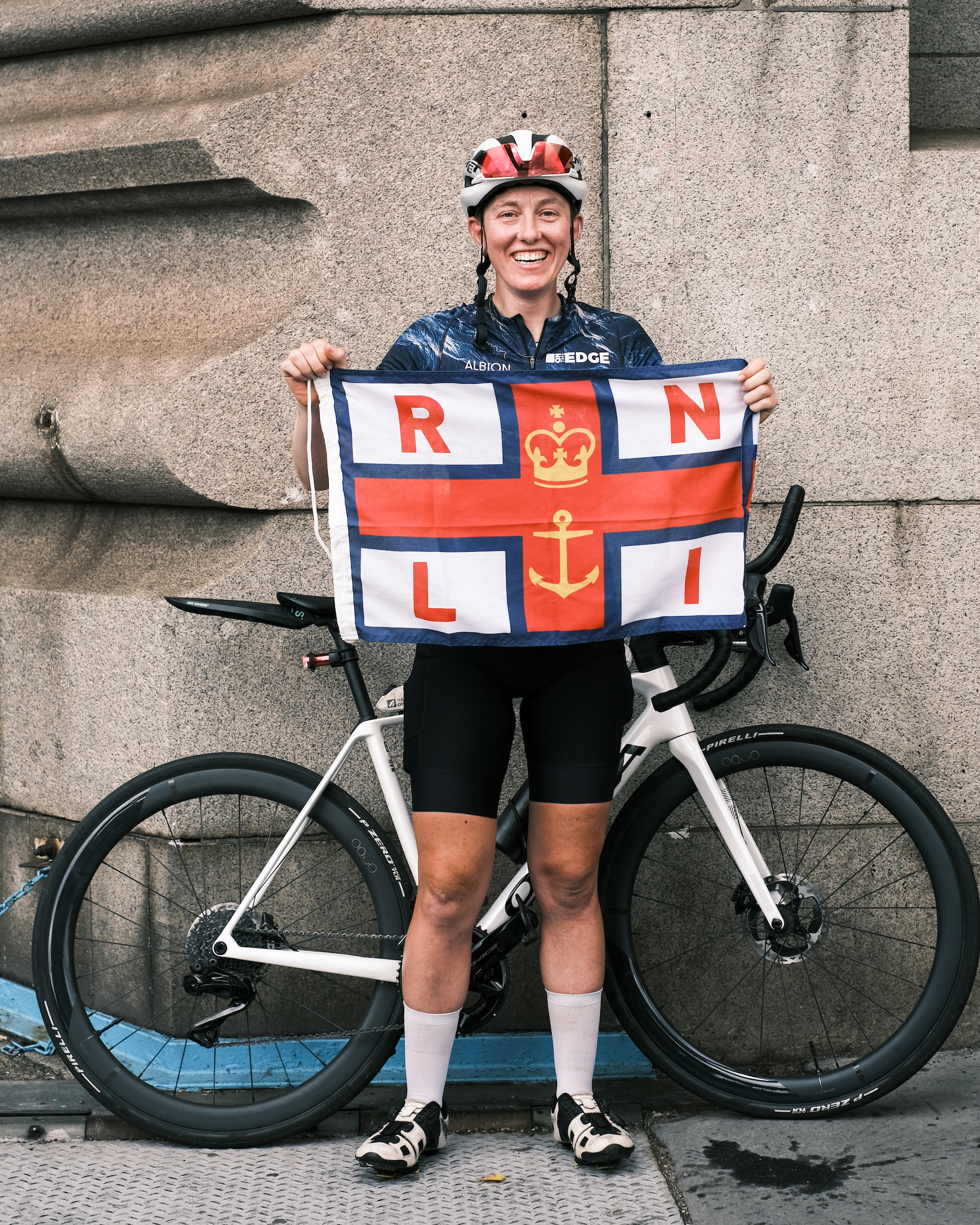 Molly weaver holds RNLI flag