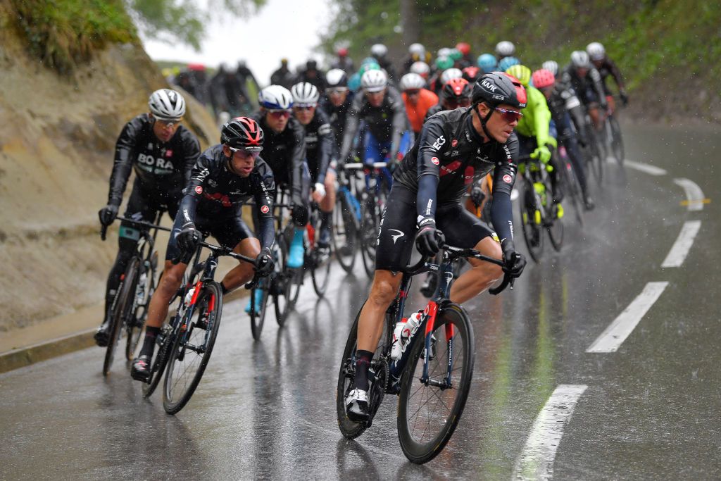 ESTAVAYER SWITZERLAND APRIL 30 Richie Porte of Australia and Team INEOS Grenadiers Rohan Dennis of Australia and Team INEOS Grenadiers during the 74th Tour De Romandie 2021 Stage 3 a 1687km stage from Estavayer to Estavayer Rain TDR2021 TDRnonstop UCIworldtour on April 30 2021 in Estavayer Switzerland Photo by Luc ClaessenGetty Images