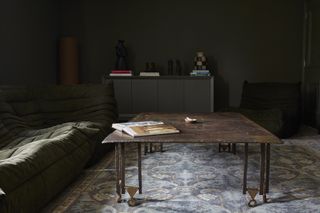 A rug in a dark cozy room