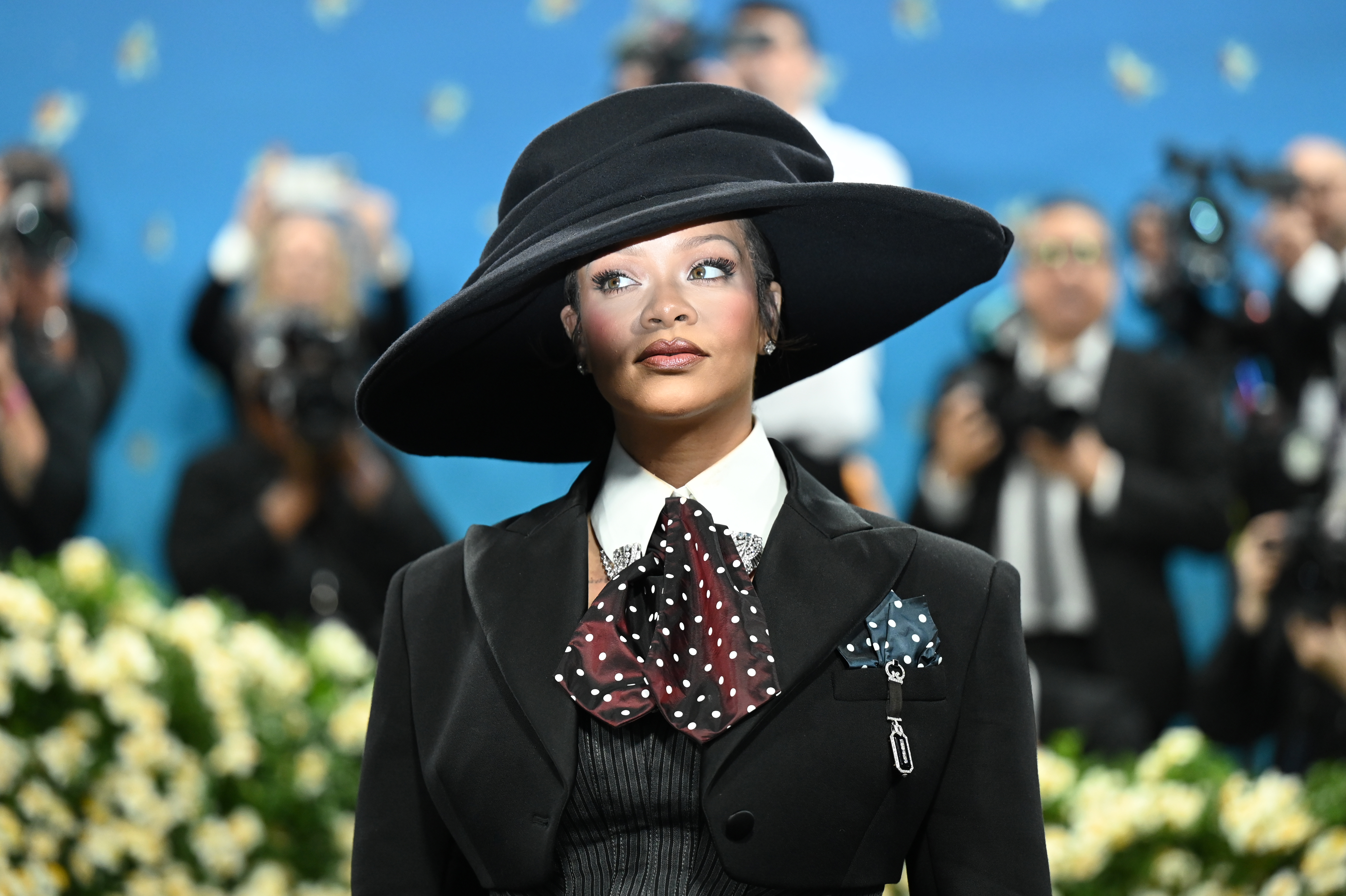 Rihanna wears a brooch
