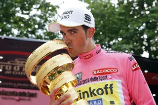Alberto Contador kisses the 2015 Giro d'Italia trophy.