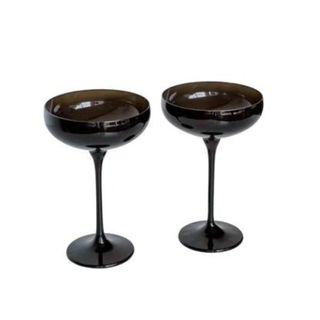 Two black champagne coupes