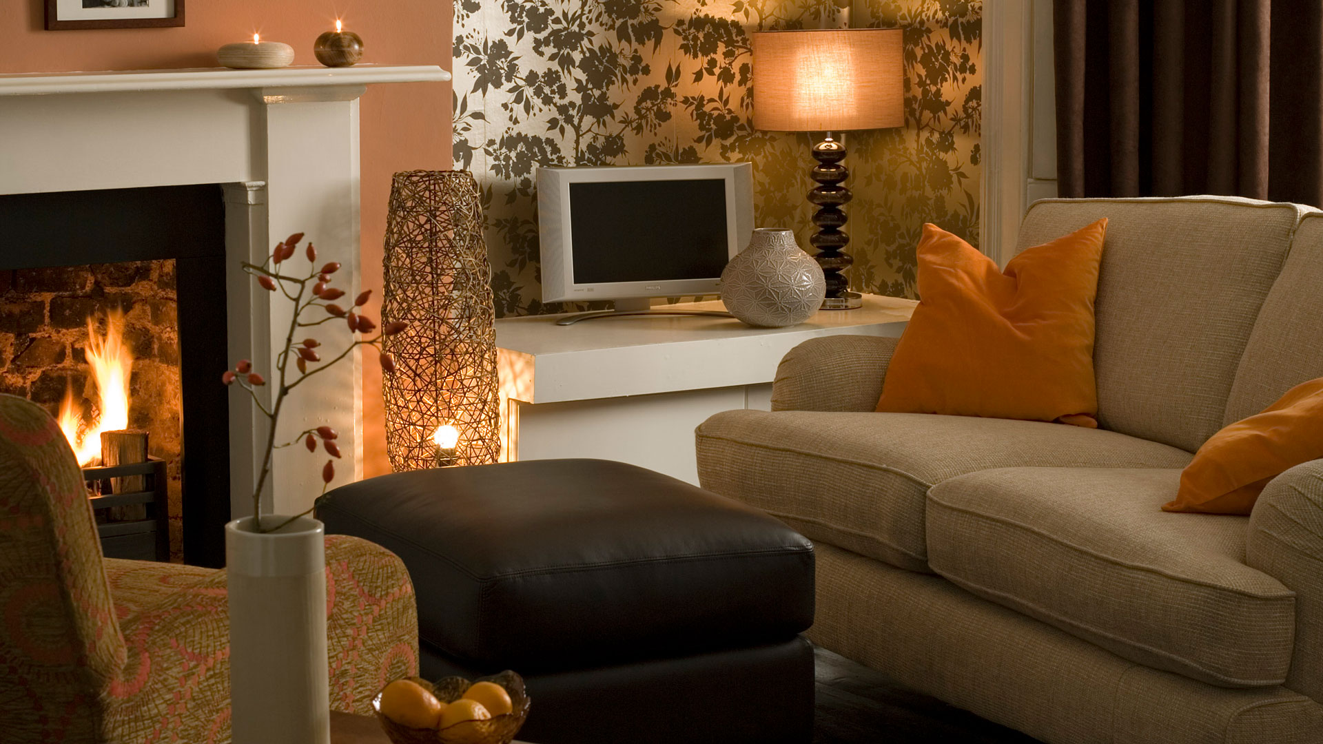 cosy living room with lamps, open fire and candles