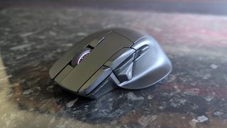 The Corsair Nightsword V2 Wireless gaming mouse pictured on a black marble worktop.