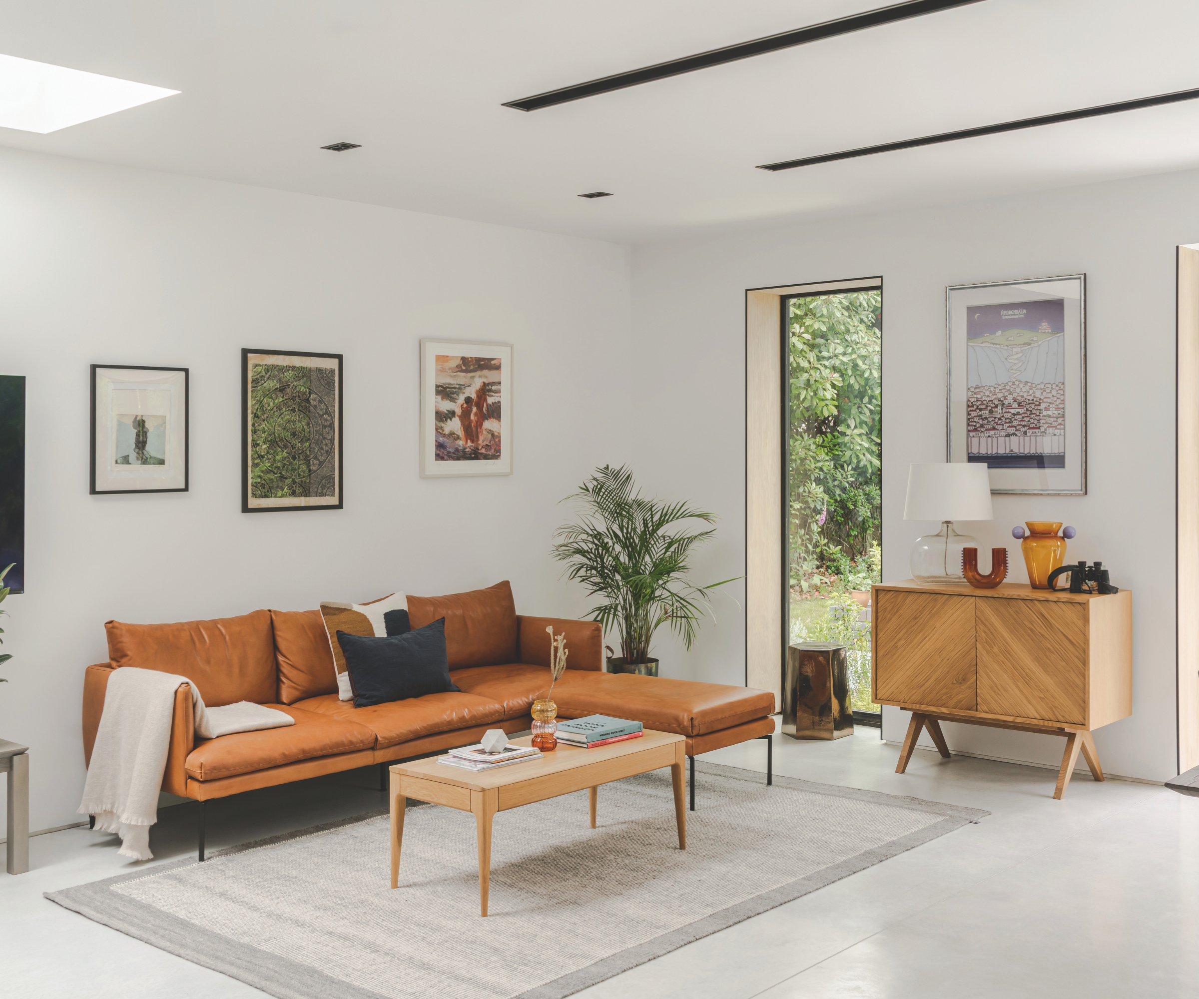 living room with grey flooring and a grey rug