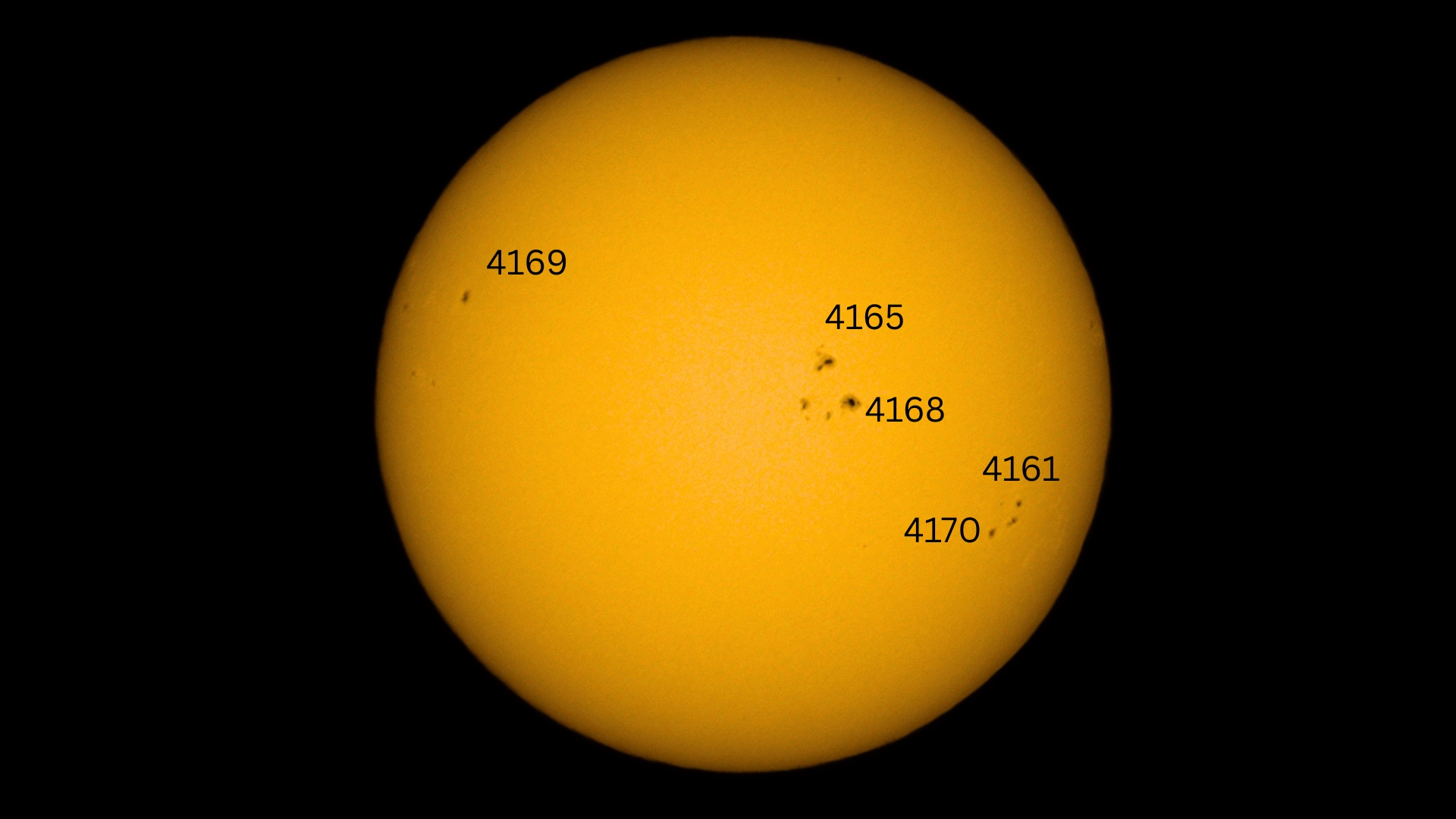 image of the sun with several sunspot regions labelled including 4168 which is visible just to the right of the center of the disk.