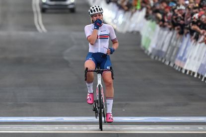 Zoe Bäckstedt crosses the line at the world championships with her hand over her mouth
