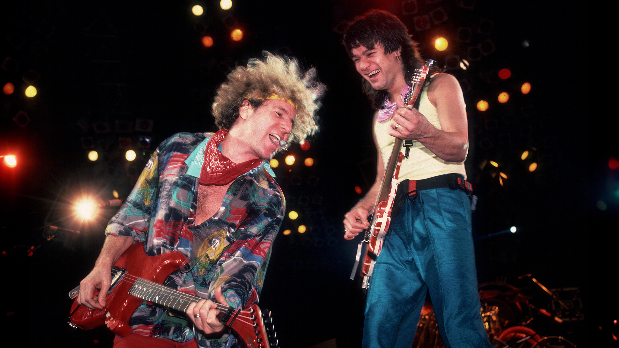 Rock musicians Sammy Hagar and Eddie Van Halen (1955 - 2020), both of the group Van Halen, perform onstage at the Metro Center, Rockford, Illinois, March 16, 1986.