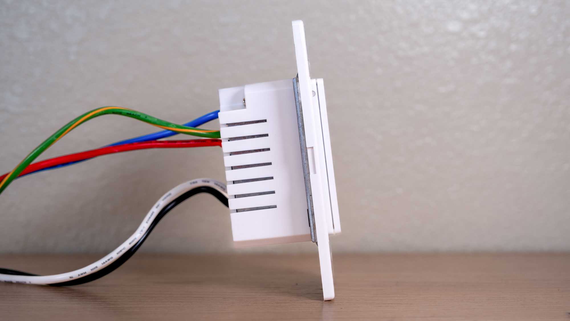A side view of the Eve Dimmer Switch showing the wiring