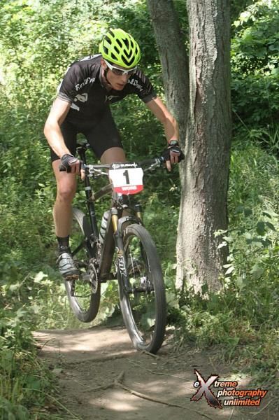Tristan Schouten hits a jump on a fast descent near the beginning of the second lap.