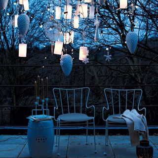 outdoor christmas decoration with chairs and lights