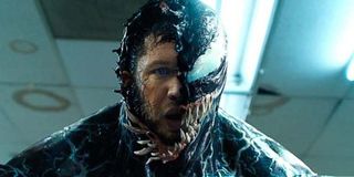 Tom Hardy's face half covered by Venom