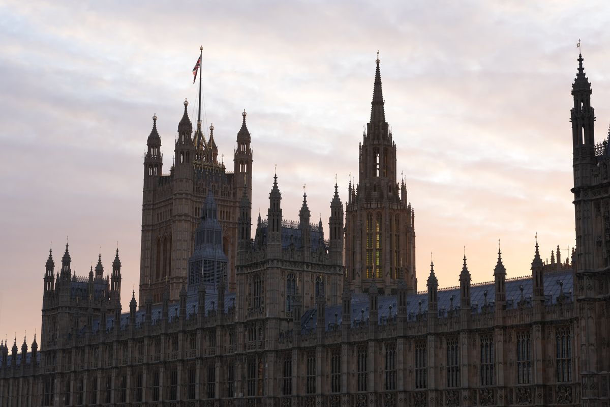 The sun setting over the Houses of Parliament in London