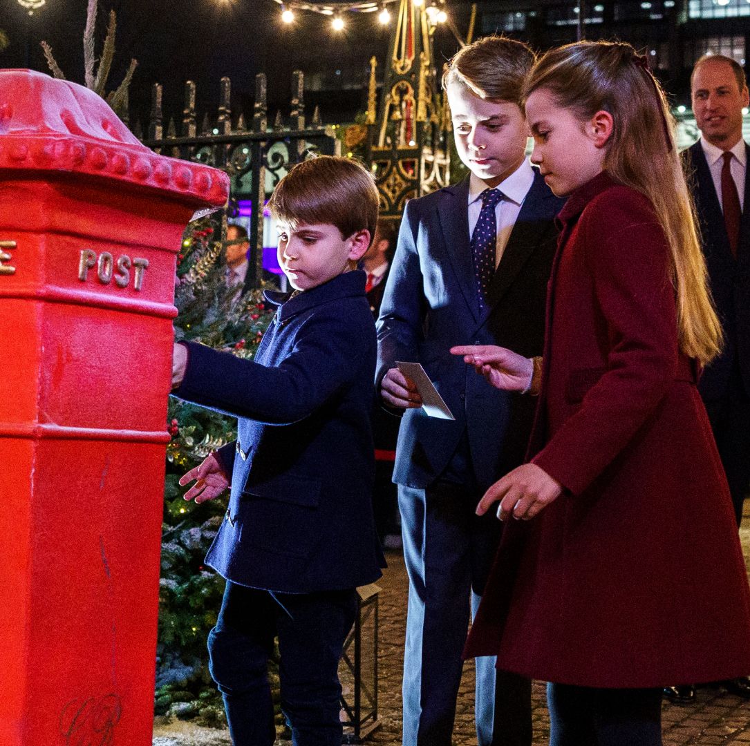 Prince George, Prince Louis and Princess Charlotte putting letters in a mailbox