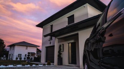 Garage door security Exterior of a house showing a car and front door