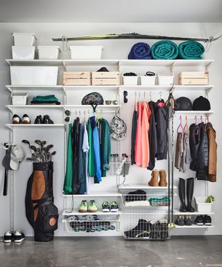 A white algot storage unit with sports equipment, clothing and footwear