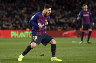 Lionel Messi celebrates with rage after scoring his second goal for Barcelona against Valencia at Camp Nou in 2019.