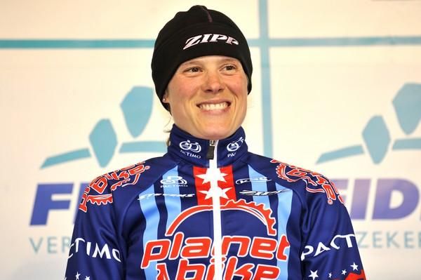 Compton smiles for the cameras on the podium in Niel.