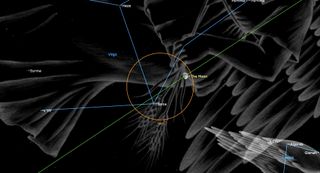 an orange circle in the center captures the convergence of three blue lines and a point labeled, "Spica." The moon is also within. A portion of a giant angel extends from above, showing an arm and part of a wing.