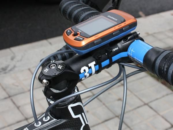 A Garmin Edge 705 GPS-enabled computer is strapped to a 3T ARX Team stem.