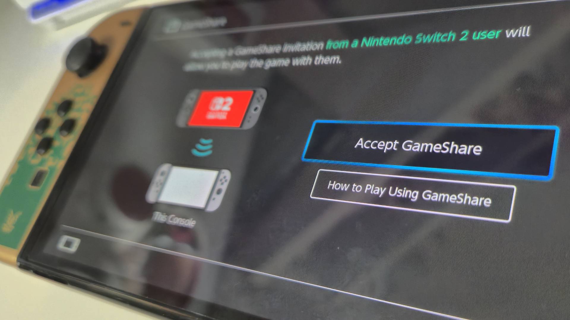 Photo of the OLED Switch showing the GameSharing feature, taken by writer Rosalie Newcombe.