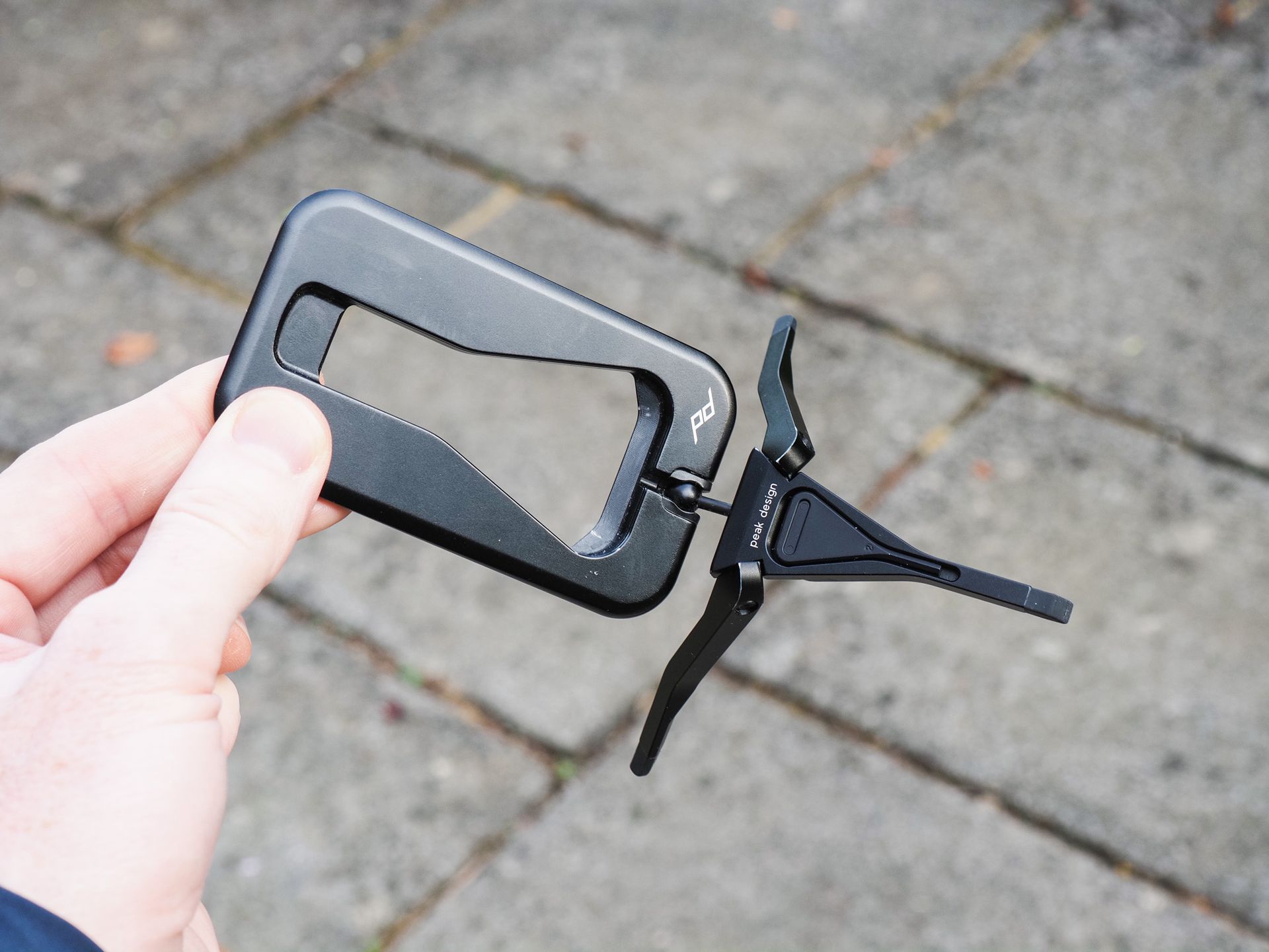 Peak Design Mobile Tripod with its legs splayed, in user's hand
