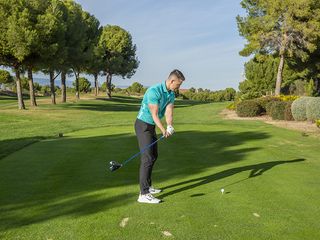 Gary Munro demonstrating the club rolling on the inside during the takeaway phase of the golf swing