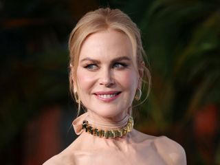 Nicole Kidman looks away from the camera smiling