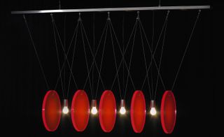 Johanna Grawunder's 'Disky' hanging light bears a fascinating resemblance to Newton's cradle