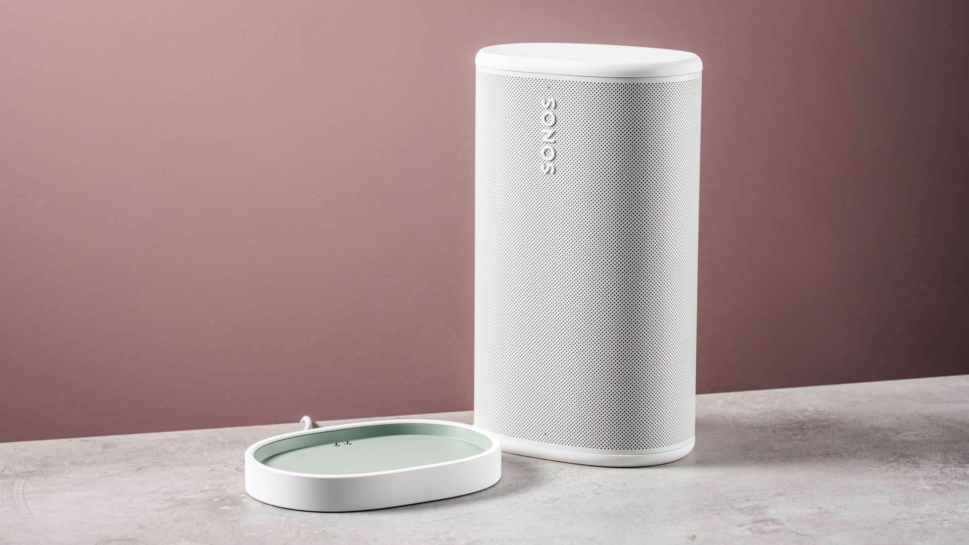 The Sonos Play speaker next to its charging cradle