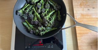 Cooking broccoli in a frying pan on the new Smeg portable induction hob