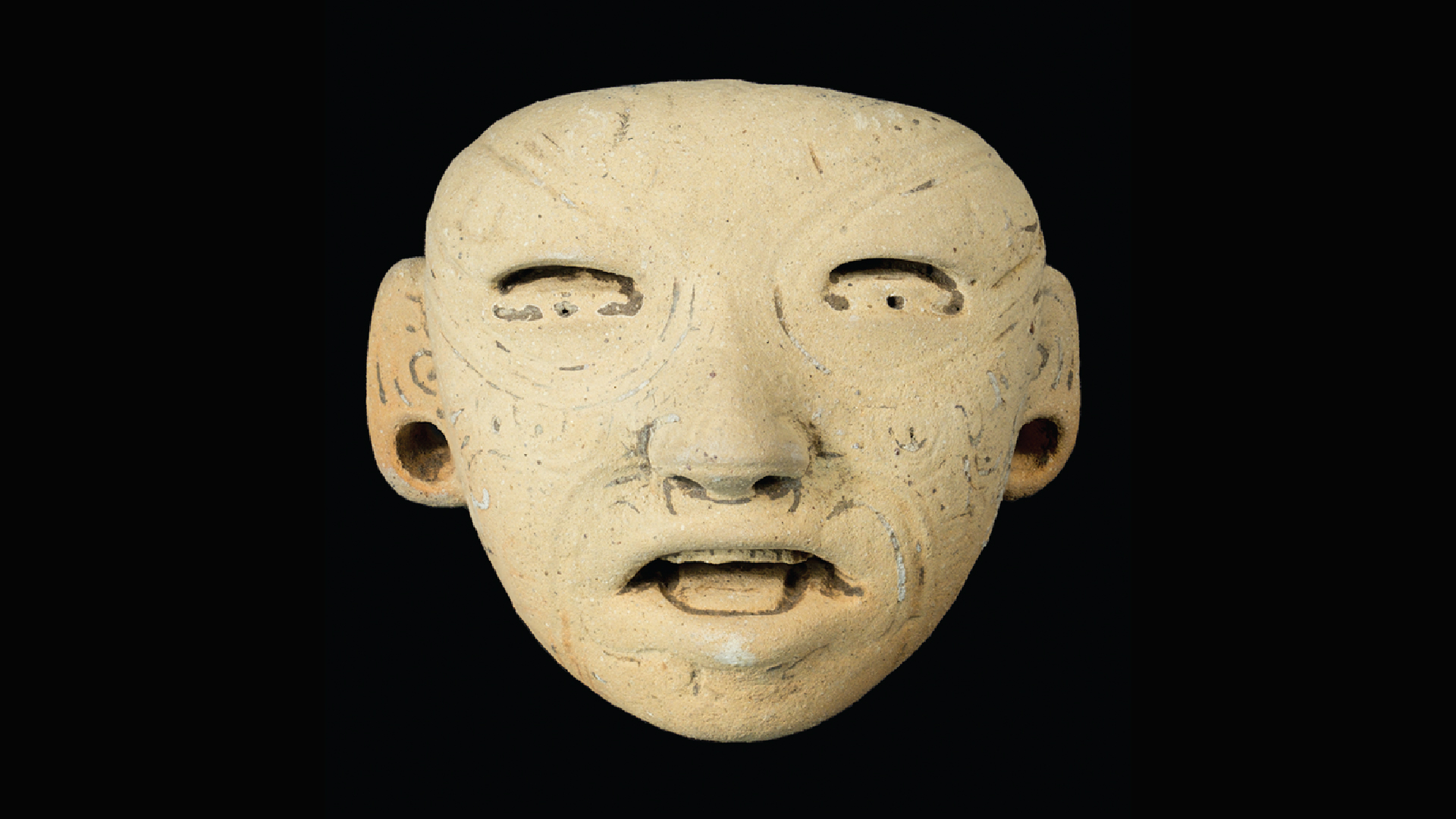 a close-up of a ceramic figurine's face