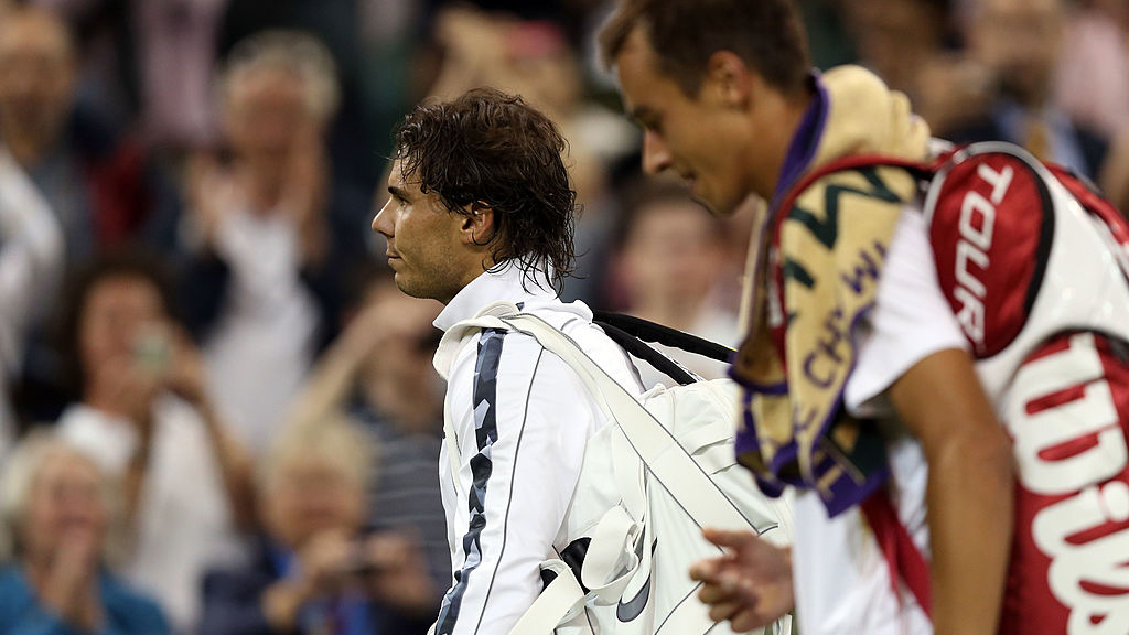 Rafa Nadal walking off the court after losing
