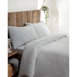 bedroom with grey bedding set