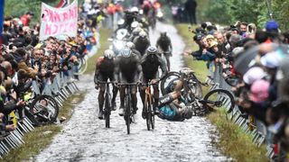 A competitors falls during the Paris-Roubaix one-day classic cycling race