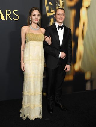 Angelina Jolie and Knox Jolie-Pitt arrives at the 2024 Governors Awards at Dolby Theatre on November 17, 2024 in Hollywood, California.