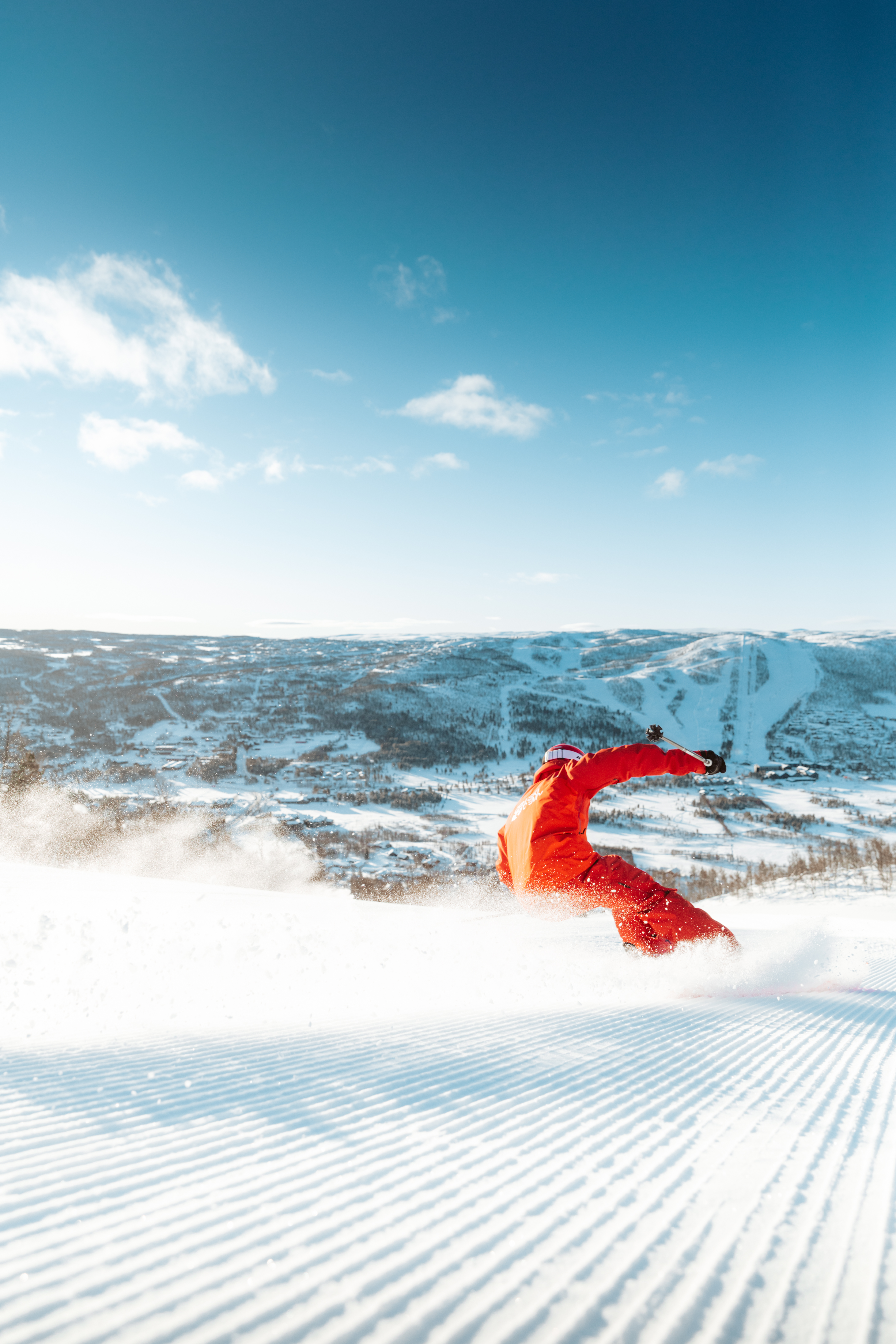 A man carves down a slope in Norway