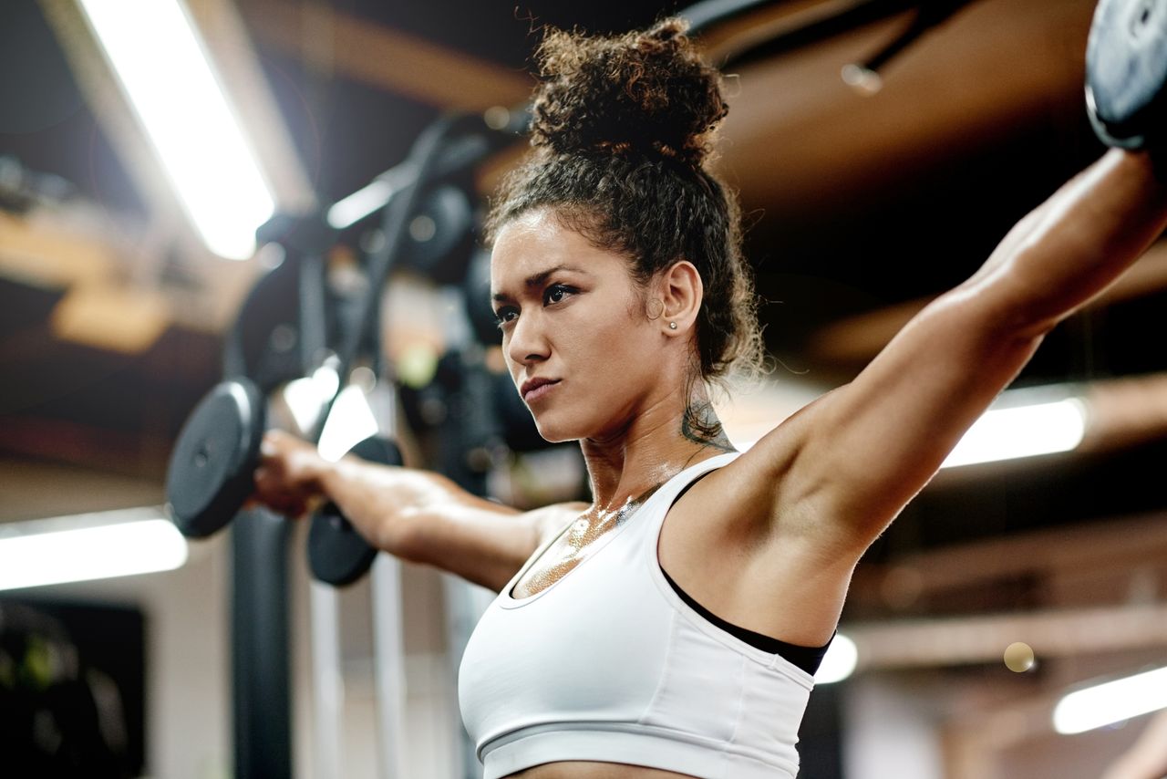 Woman lifting dumbbells