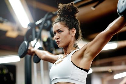 Woman lifting dumbbells