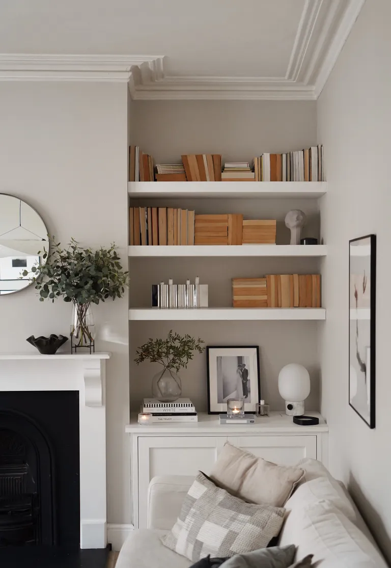 books reversed on bookshelves in Scandi style living room