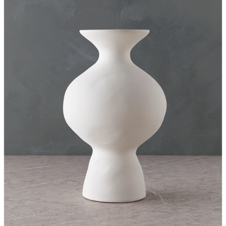 white matte stoneware vase with a curved silhouette